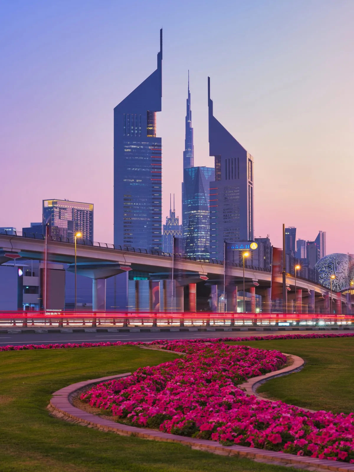 Jumeirah Emirates Towers rising against a blue Dubai sky