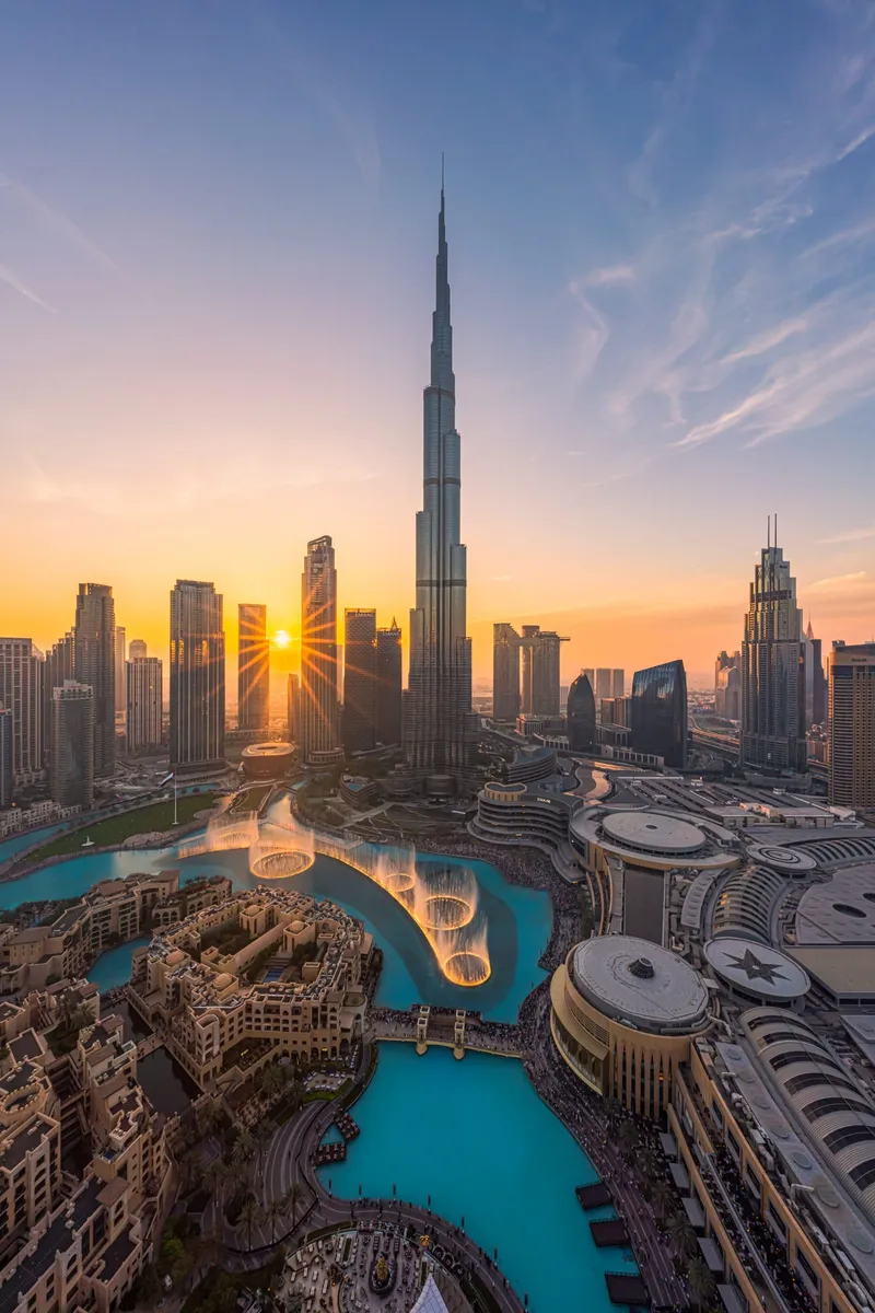 Burj Khalifa rising above Downtown Dubai against a clear sky.