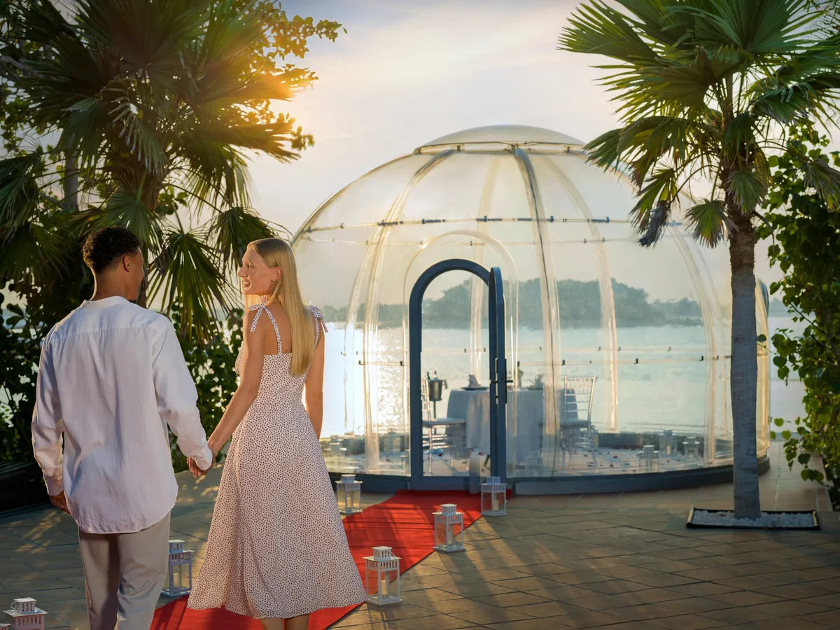 Dining terrace at the Anantara The Palm Resort overlooking the Palm Jumeirah lagoon.