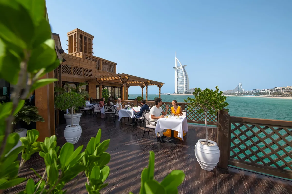 Waterfront fine dining on the deck at Pier Chic, Dubai.
