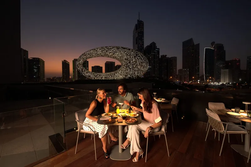 Elegant evening dining beside the Museum of the Future, Dubai.