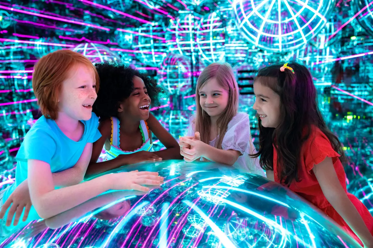 Families enjoying the immersive light and art experience at AYA Dubai in Wafi Mall
