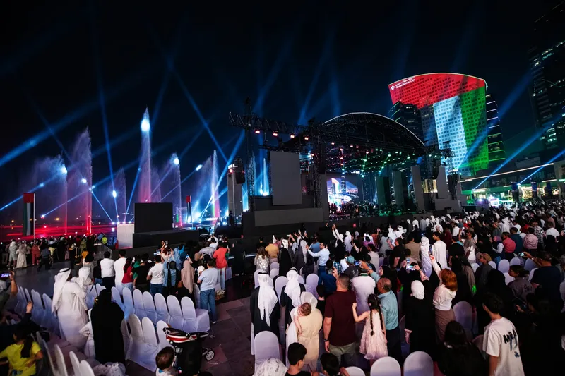 Performance during an Eid Al Etihad celebration in Dubai, with artist Balqees on stage.