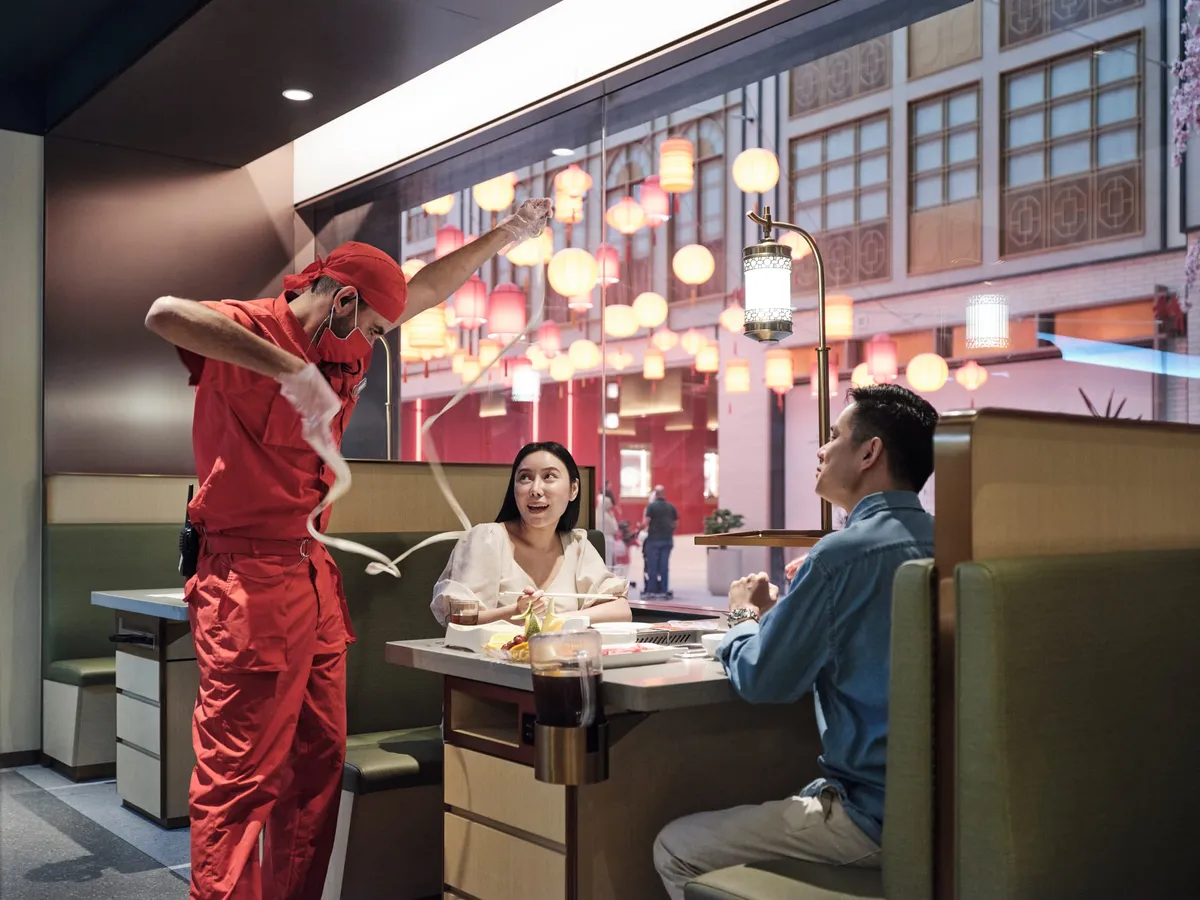 Diners at Haidilao Hotpot inside Dubai Mall's Chinatown section
